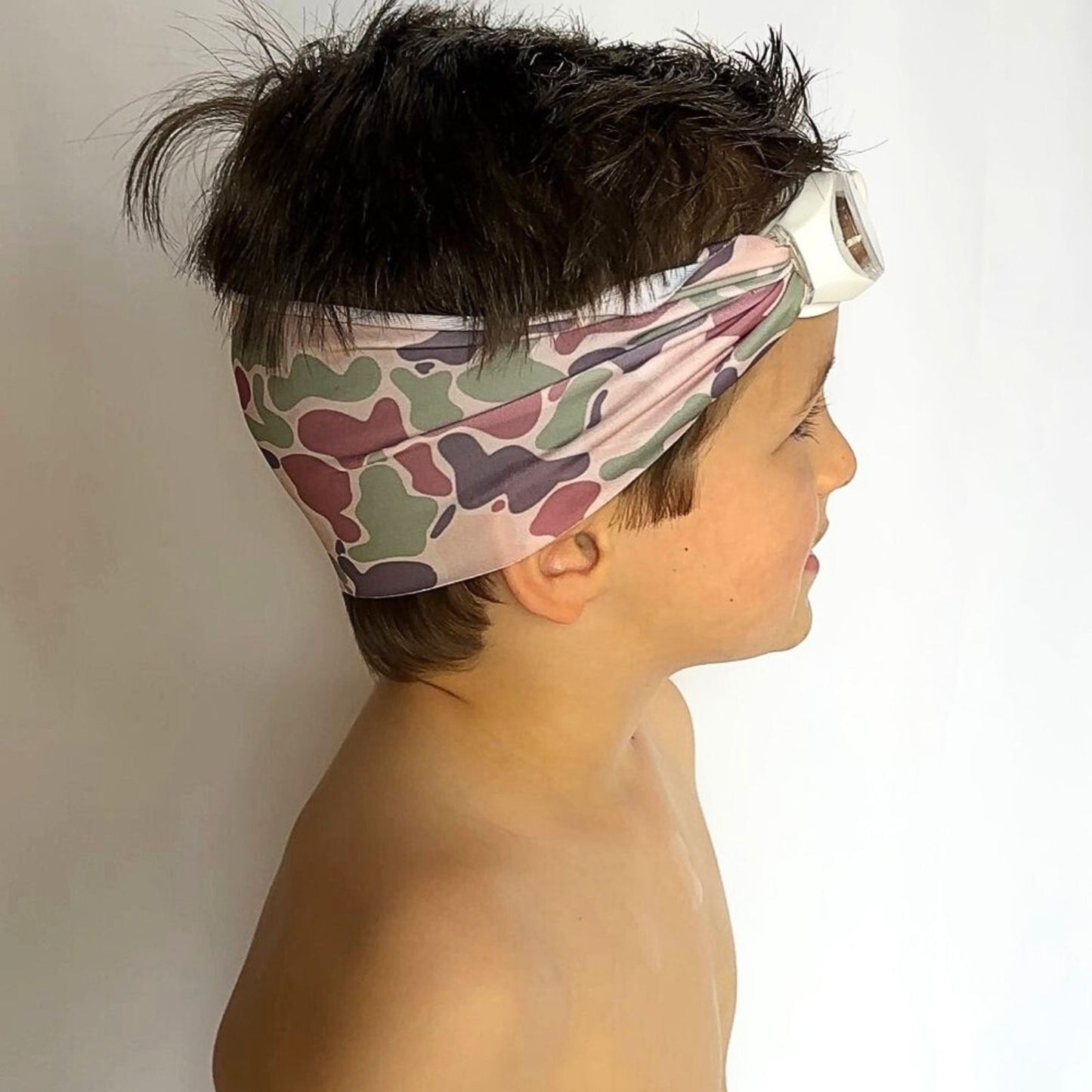 side view of green and brown camo kids swim goggles with adjustable fabric strap and floatable goggles – Snappy Goggles
