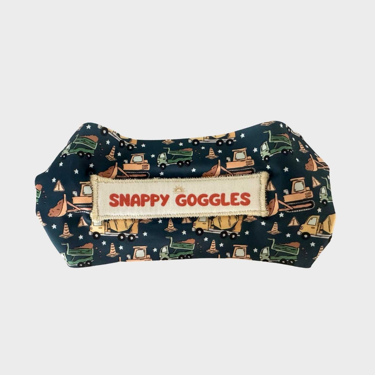 Blue Fabric swim goggles with construction vehicle pattern and 'Snappy Goggles' floatable goggles for kids.