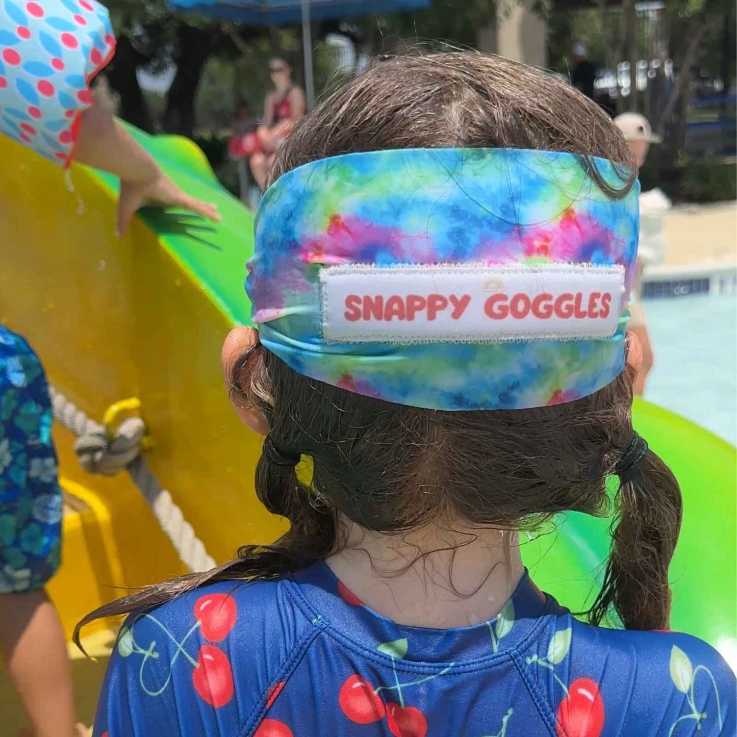 back view of colorful groocy tie dye fabiric kid swim goggles with adjustable, fabric strap – Snappy Goggles