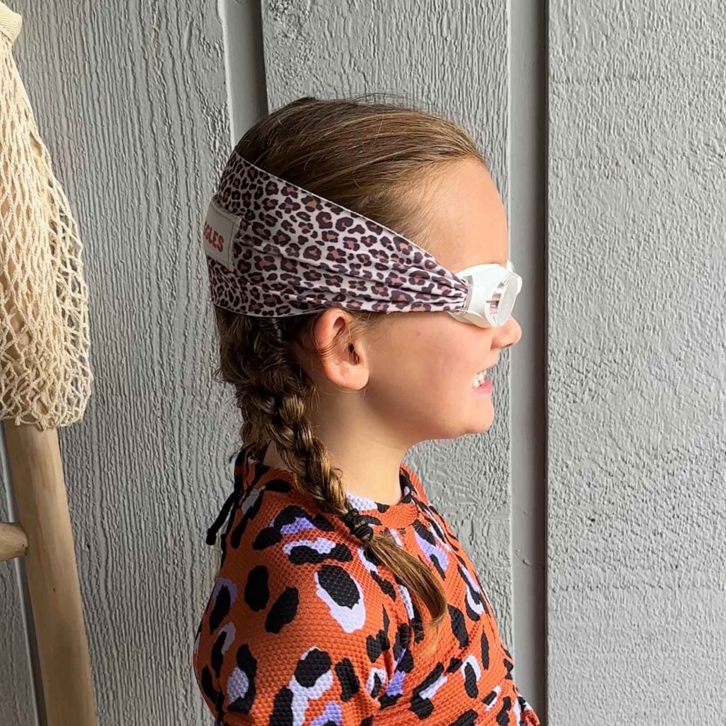 side view of leopard kids swim goggles with adjustable fabric strap and floatable goggles – Snappy Goggles