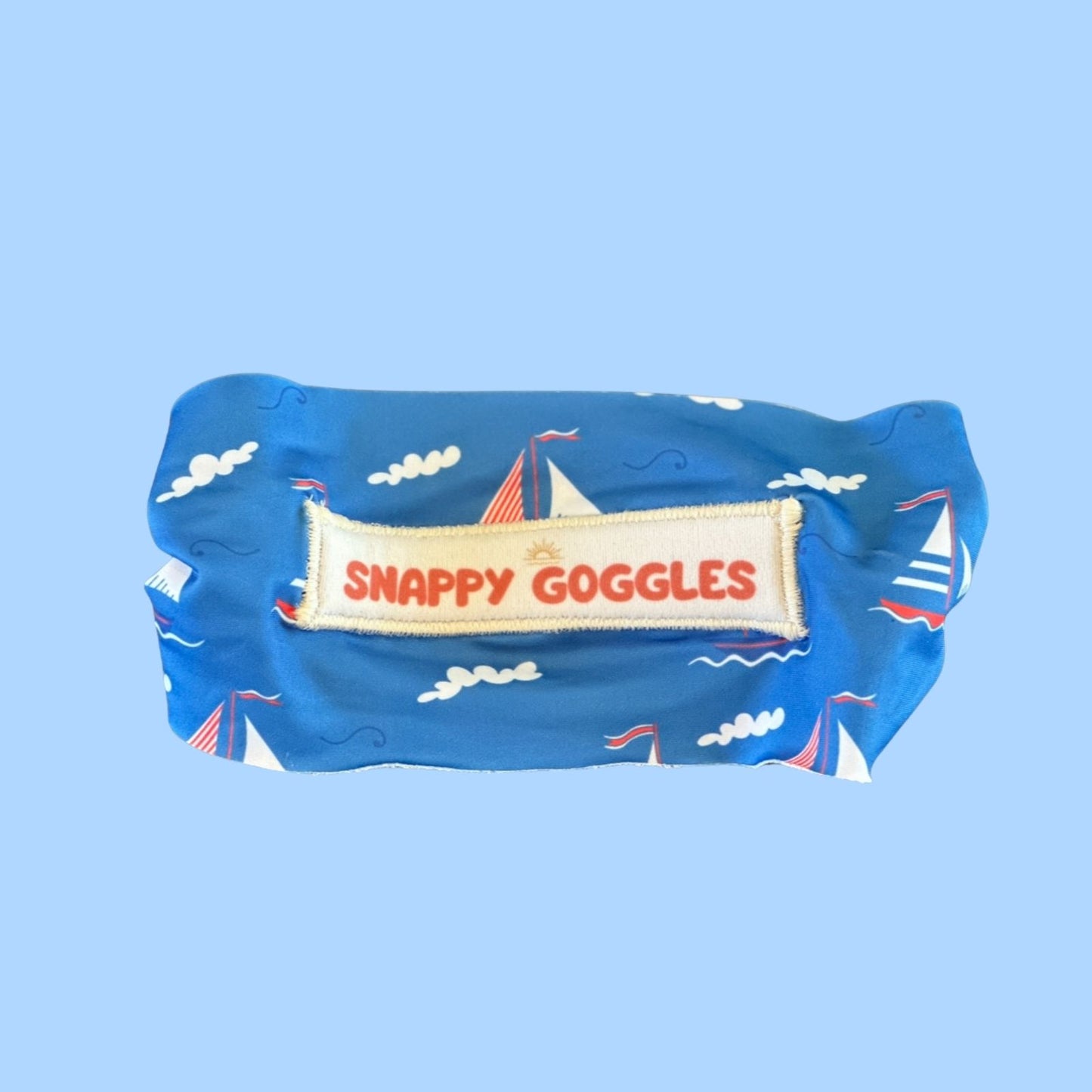 back view of blue Sail With Me kids swim goggles with adjustable fabric strap and nautical design – Snappy Goggles