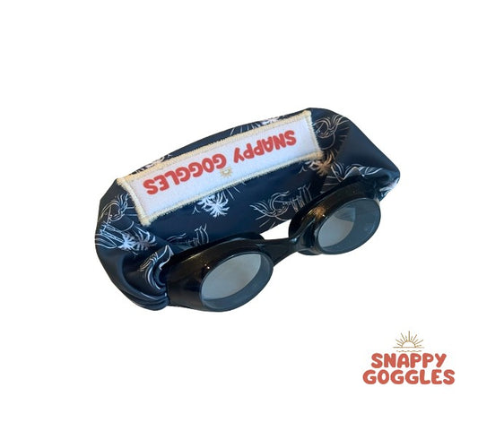 black frame swim goggles featuring a blue island vibe fabric strap that is adjustable and floatable - Snappy Goggles