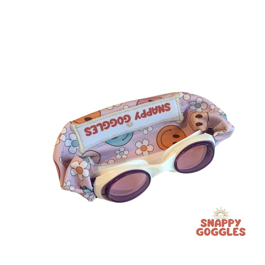 Children's swimming goggles with floral design and smiley faces 'Snappy Goggles'.