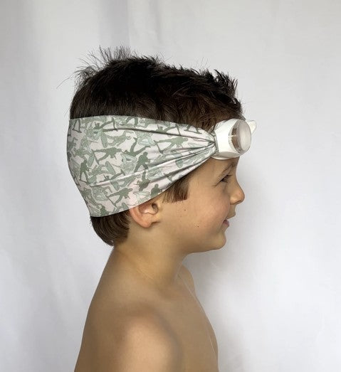 side view of a boy wearing fabric strap swim goggles with g i joe pattern - Snappy Goggles