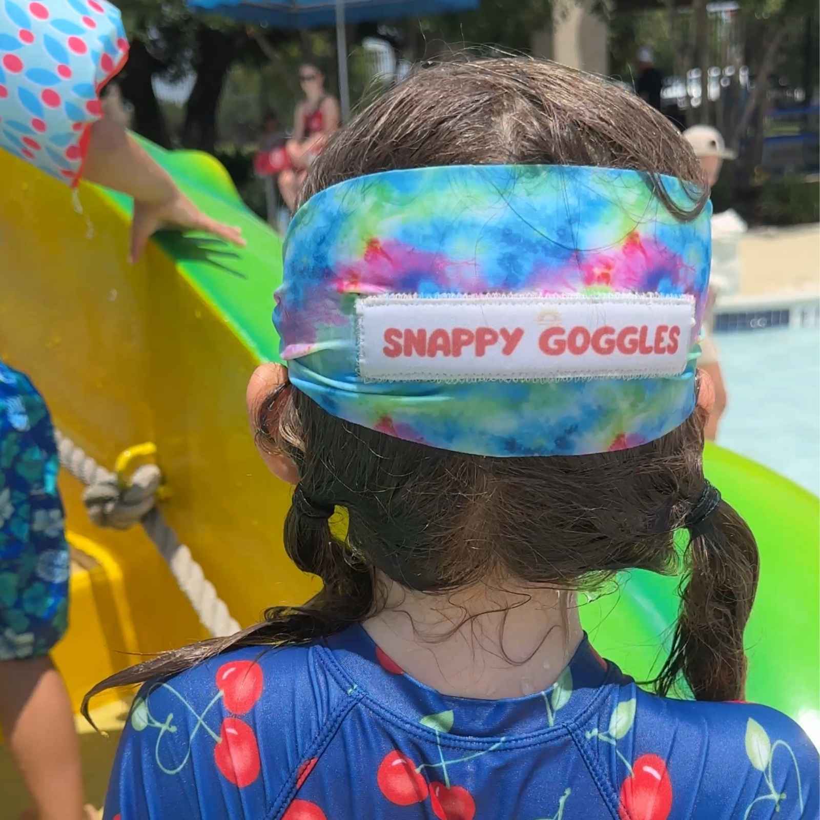 back view of colorful groocy tie dye fabiric kid swim goggles with adjustable, fabric strap – Snappy Goggles